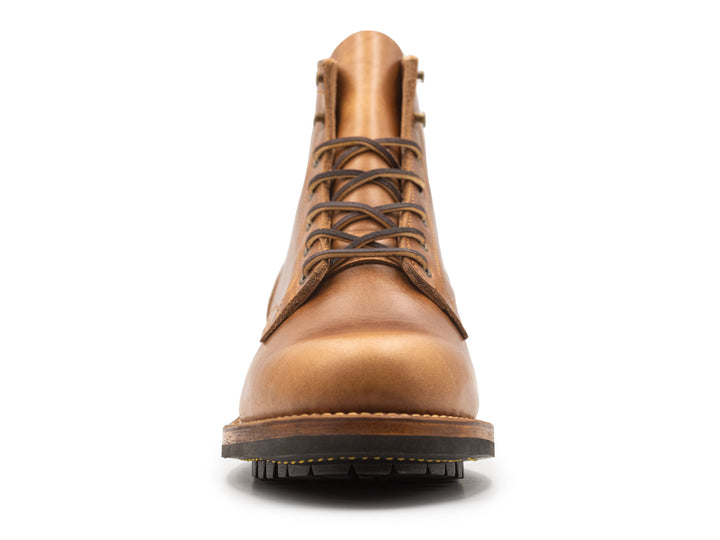 tan leather boot on a white background front view