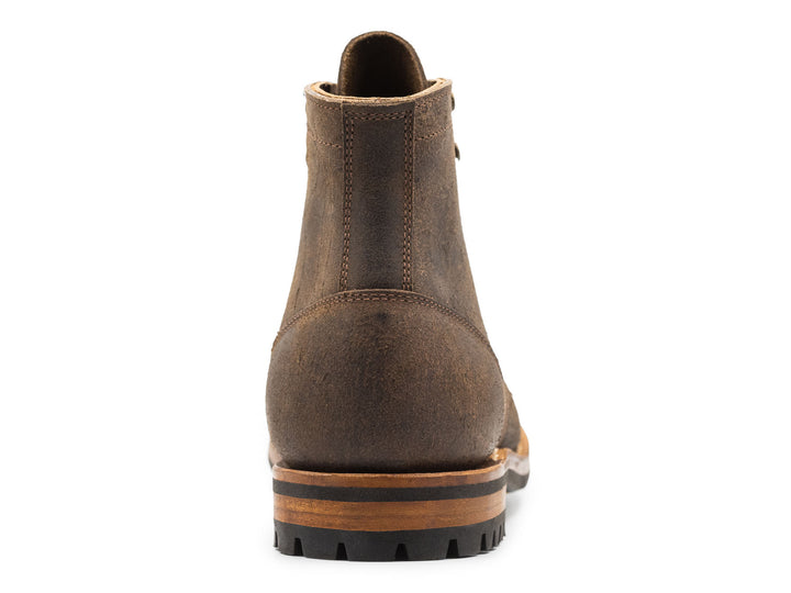 gray leather boot on a white background view from behind