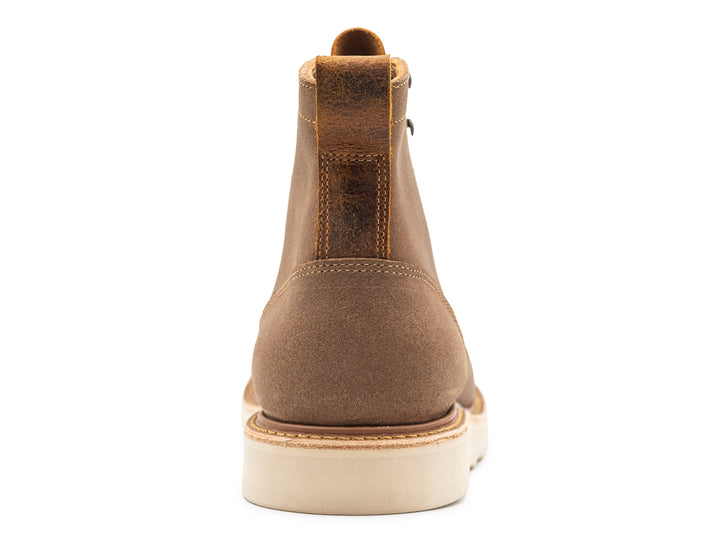 back view of brown leather boot on white background