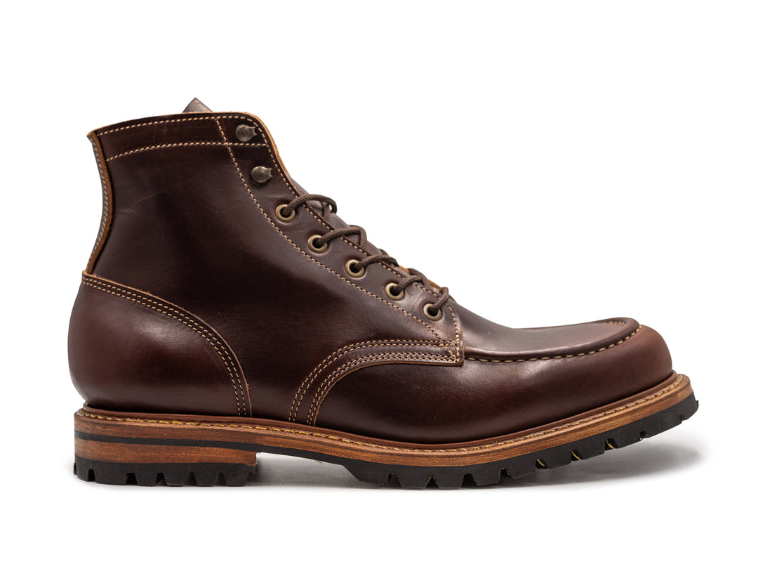 A dark brown leather lace-up ankle boot with contrast stitching, a stacked brown and black sole, and metal eyelets, shown from a side profile on a white background.