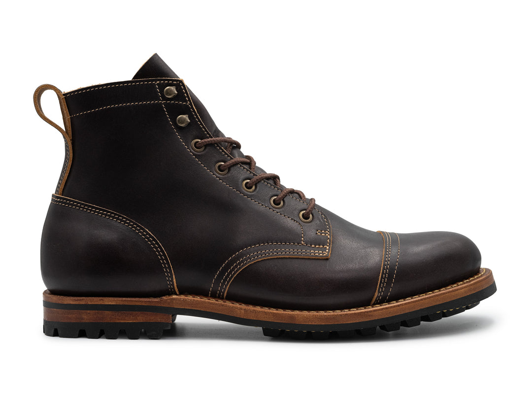 black leather boot on white background