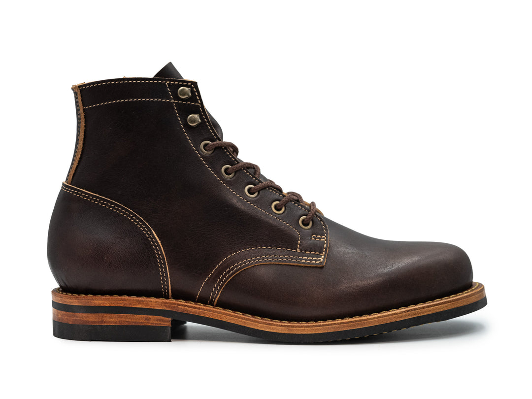 black leather boot on white background