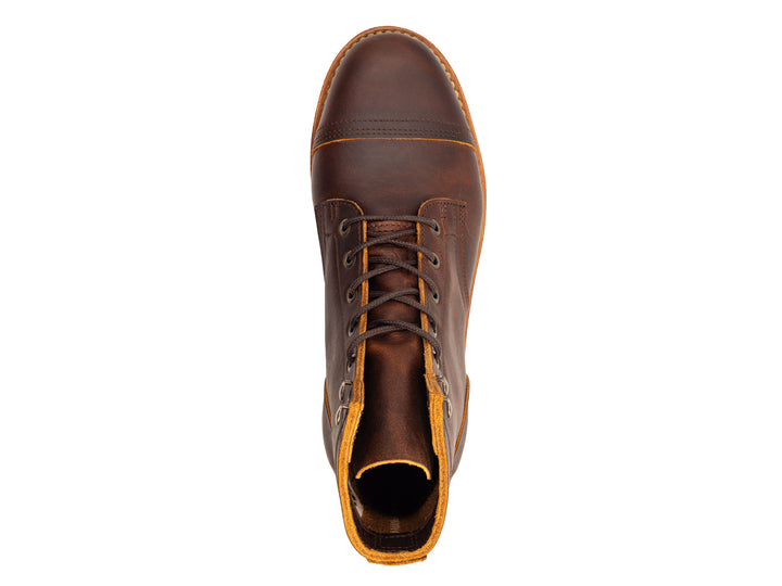 Brown leather boot with a white background topdown view