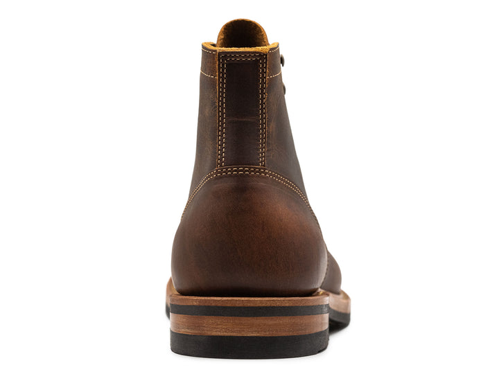 rich brown leather boot on a white background front view