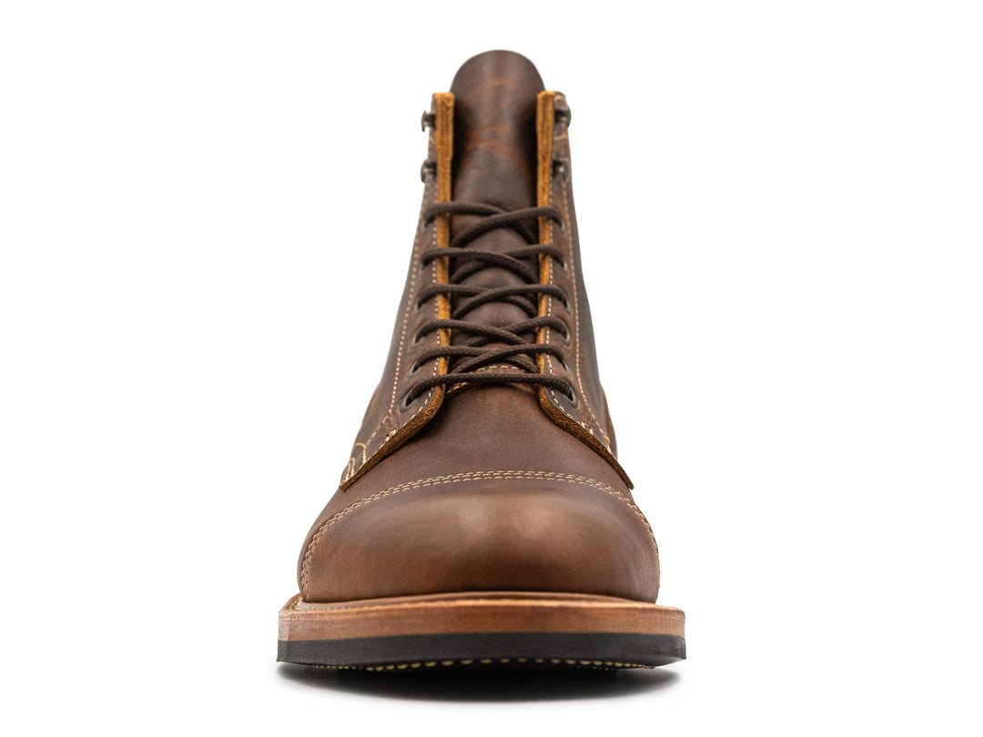 rich brown leather boot on a white background front view