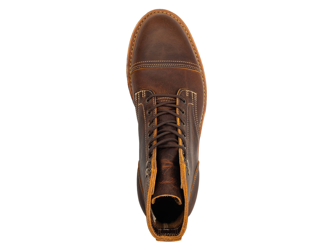 rich brown leather boot on a white background topdown view