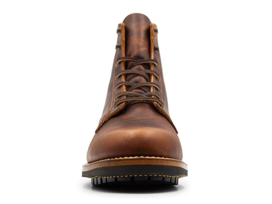 rich brown leather boot on a white background front view