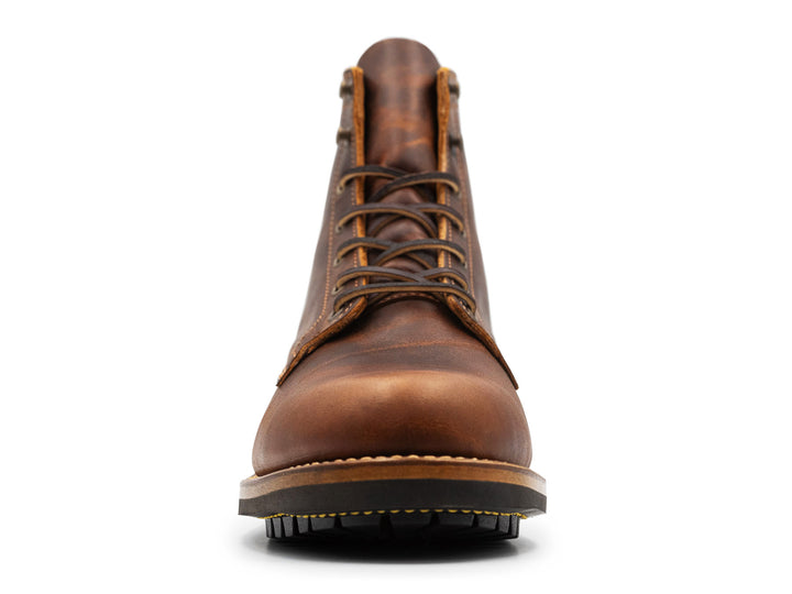 rich brown leather boot on a white background front view