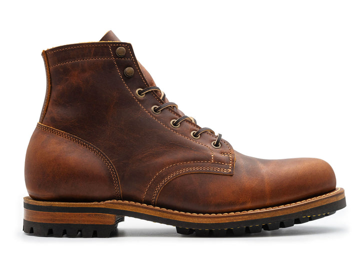 rich brown leather boot on a white background side view