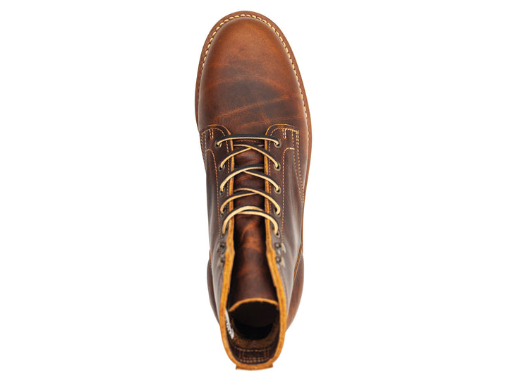 rich brown leather boot on a white background view from behind