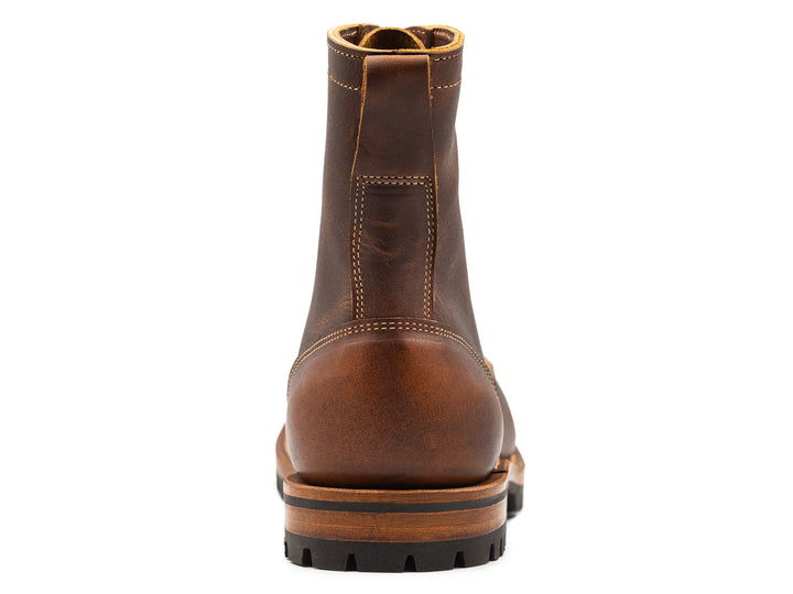 auburn brown leather boot on a white background view from behind