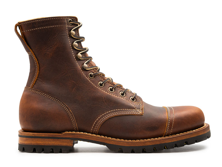 auburn brown leather boot on a white background side view