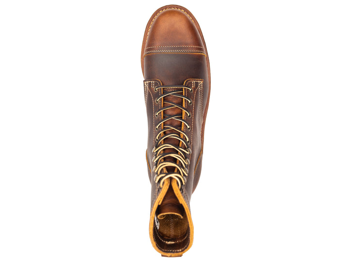 auburn brown leather boot on a white background topdown view