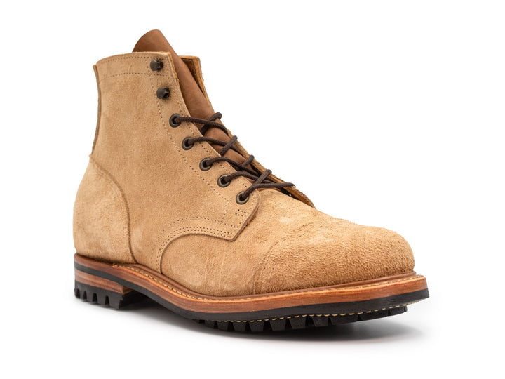 3qtr view of tan rough out leather boot on white background